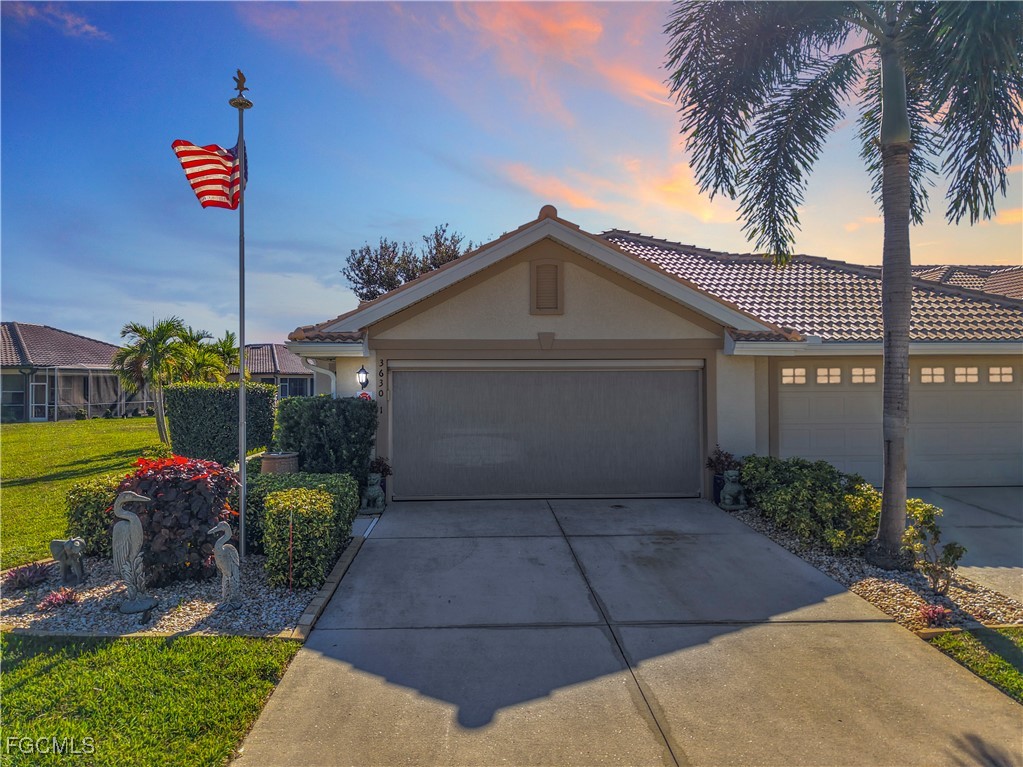 3630 Rue Alec Loop, Unit 1 North Fort Myers, FL 33917 - Photo 3 of 50 a front view of a house having yard