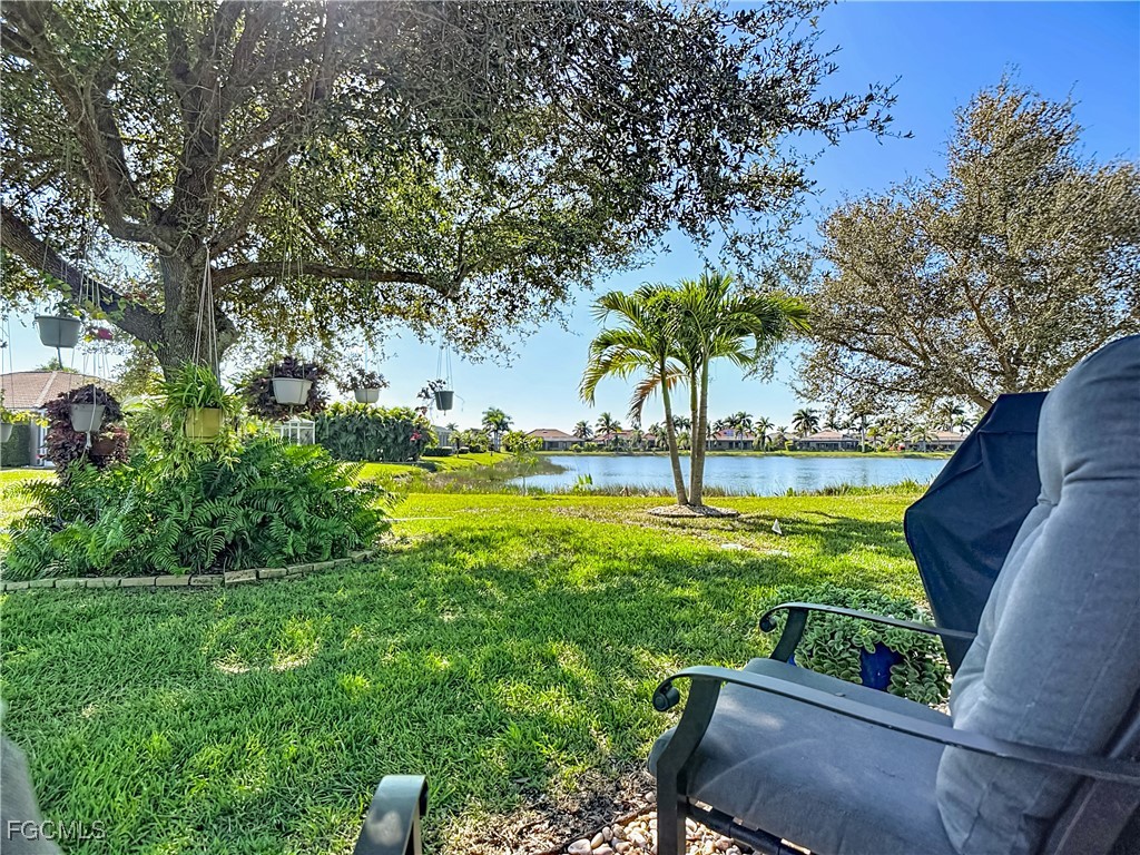 3630 Rue Alec Loop, Unit 1 North Fort Myers, FL 33917 - Photo 35 of 50 a view of yard with swimming pool outdoor seating and green space