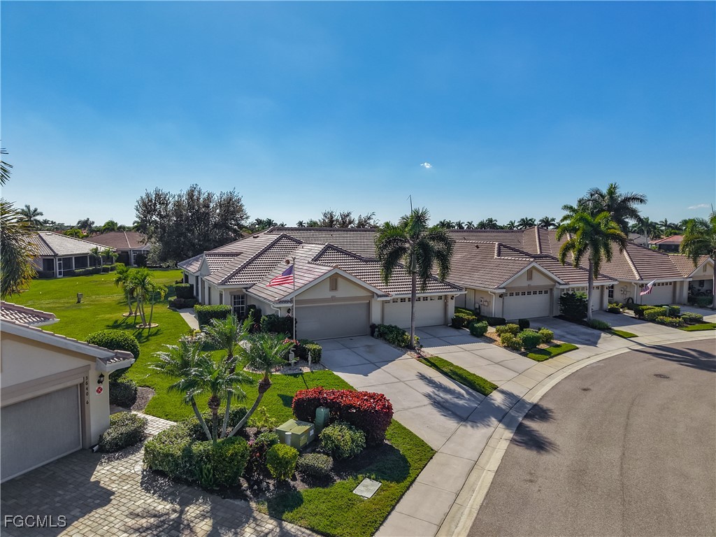 3630 Rue Alec Loop, Unit 1 North Fort Myers, FL 33917 - Photo 38 of 50 a backyard of a house with table and chairs