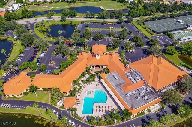 an aerial view of a resort with swimming pool and outdoor space
