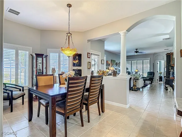 a dining room with furniture and window