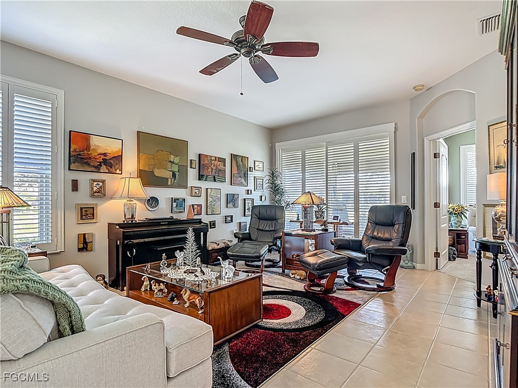3630 Rue Alec Loop, Unit 1 North Fort Myers, FL 33917 - Photo 7 of 50 a living room with furniture fireplace and a window