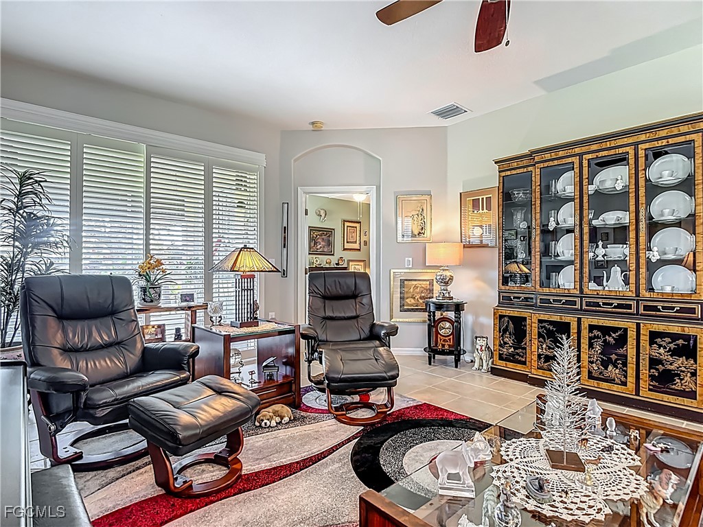 3630 Rue Alec Loop, Unit 1 North Fort Myers, FL 33917 - Photo 9 of 50 a living room with furniture and a fireplace