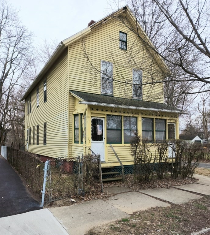 115 Greene Street Springfield, MA 01109 - Photo 1 of 4 a front view of a house with garden