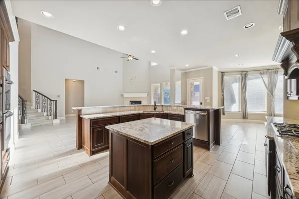 a kitchen with a stove and a refrigerator