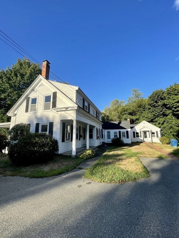 767 North Main Street, Unit 1 Randolph, MA 02368 - Photo 1 of 12 a front view of a house with garden