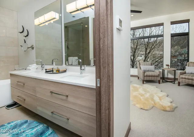 a bathroom with a sink and a shower
