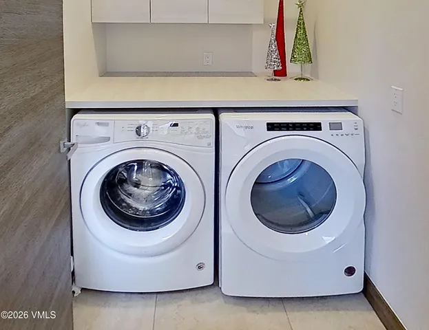 a bedroom with a bed mirror and a window