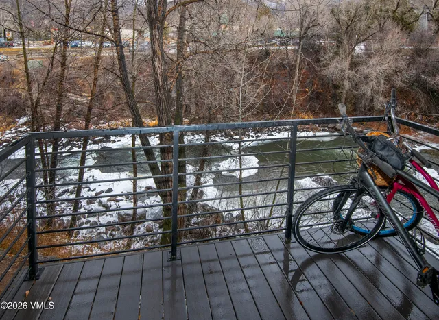 a view of lake from next to a house