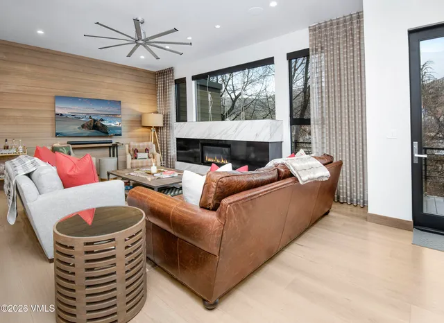 a living room with furniture and a table