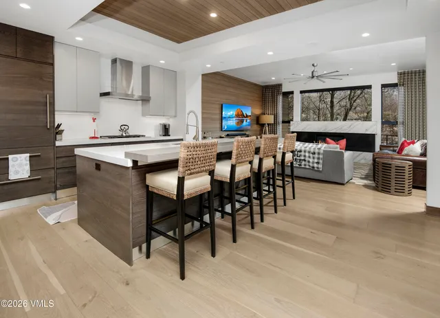 a kitchen with stainless steel appliances granite countertop a sink and a stove