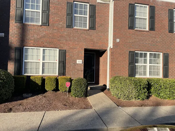 a front view of a house having yard