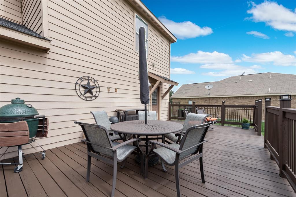 149 Cattlemans Creek Road Newark, TX 76071 - Photo 25 of 39 Oversized and newly stained backyard deck at 149 Cattlemans Creek Rd in the Chisholm Springs neighborhood in Newark, TX 76071