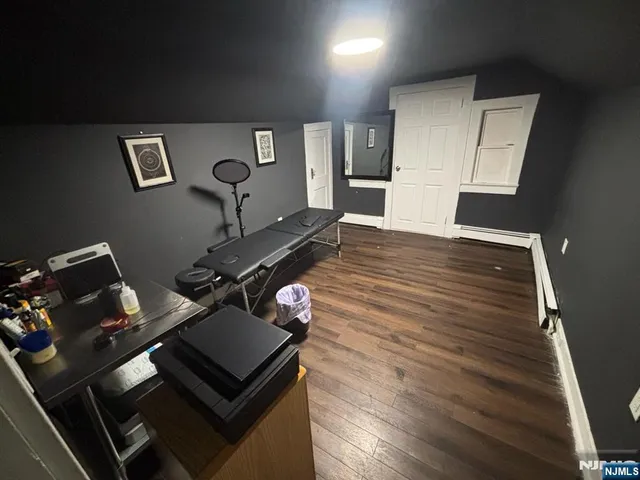 a kitchen with a stove and white cabinets