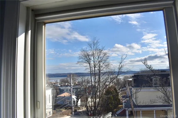 a view of a balcony with a tree