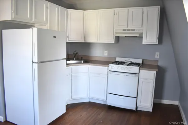a kitchen with appliances and cabinets