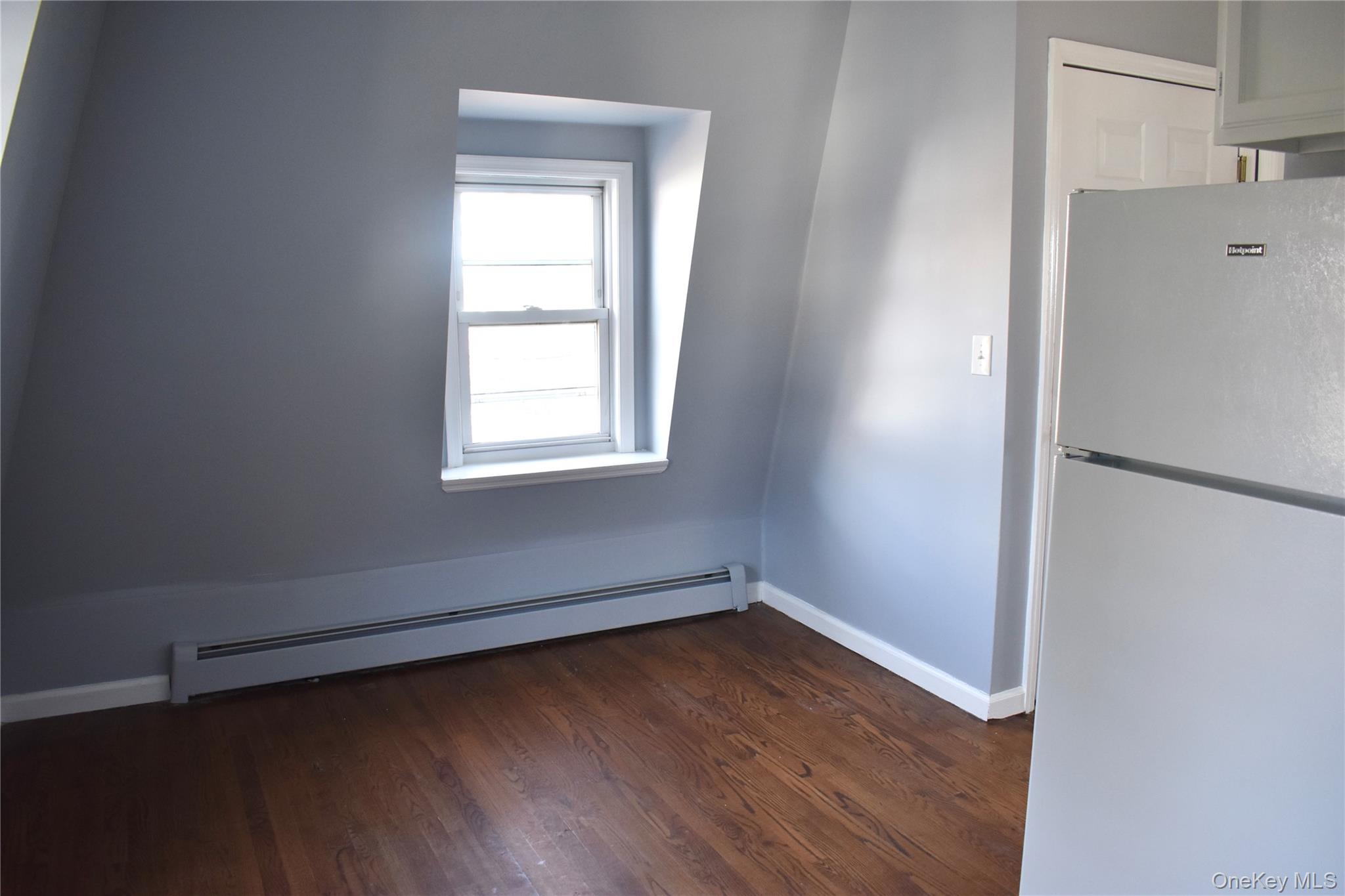 46 Prospect Street, Unit 3 Nyack, NY 10960 - Photo 4 of 12 a view of a room with wooden floor and a window
