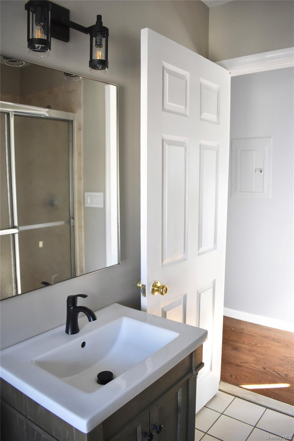 46 Prospect Street, Unit 3 Nyack, NY 10960 - Photo 9 of 12 a bathroom with a sink and a mirror