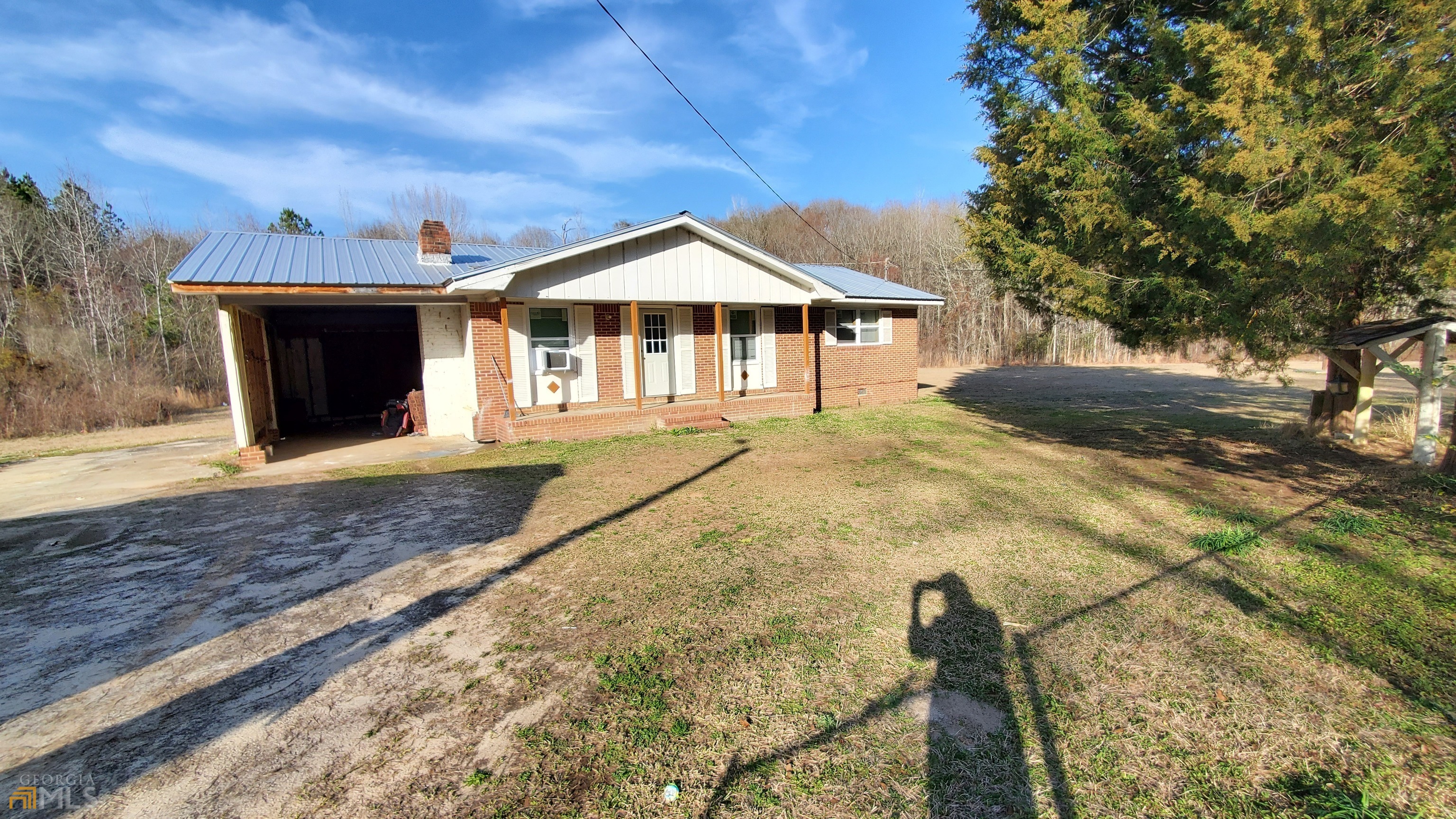 116 Shepard Road Bartow, GA 30413 - Photo 1 of 1 a front view of a house with a yard