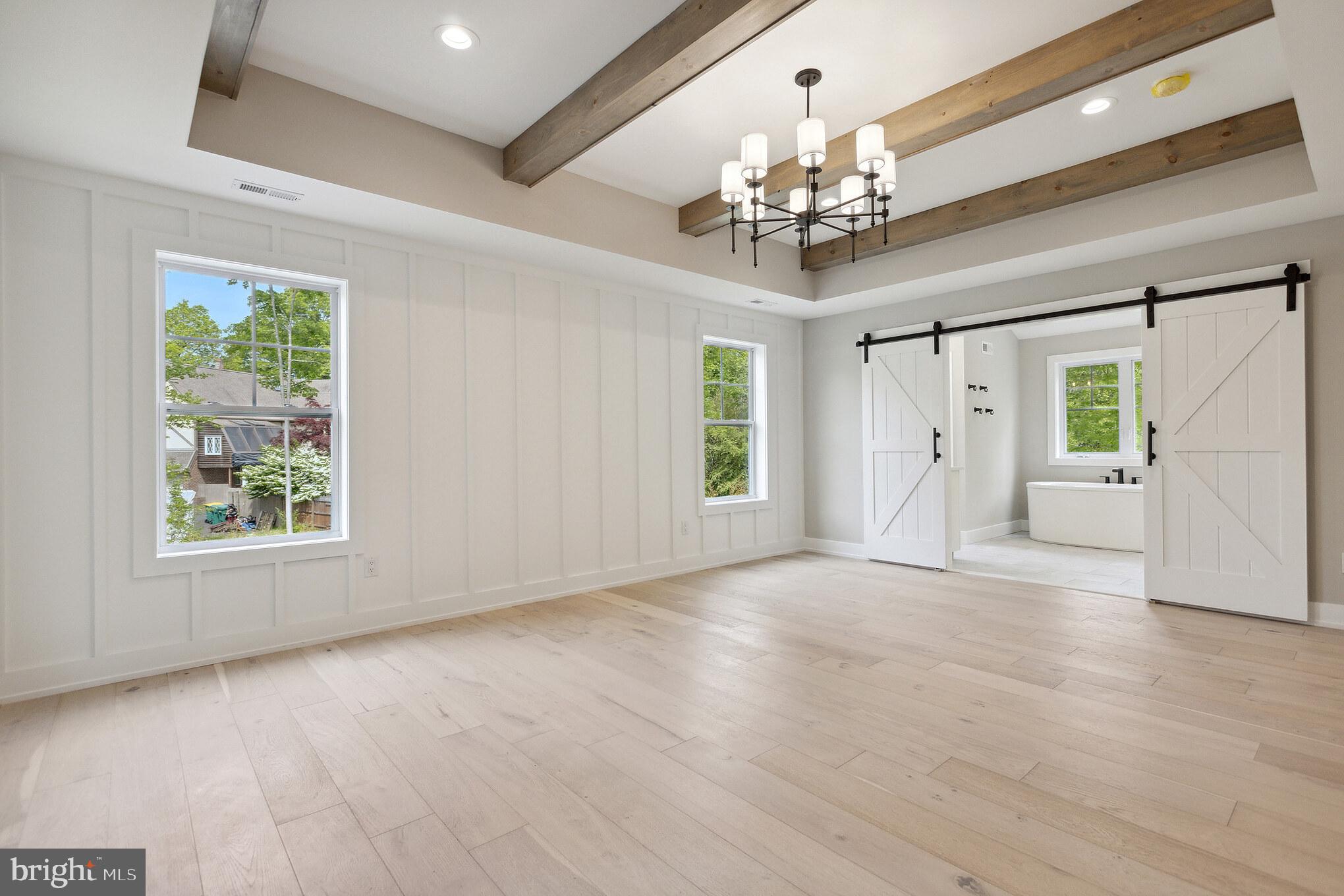 1 Beech Hollow Road Lower Gwynedd, PA 19002 - Photo 14 of 17 a view of an empty room with a window and wooden floor