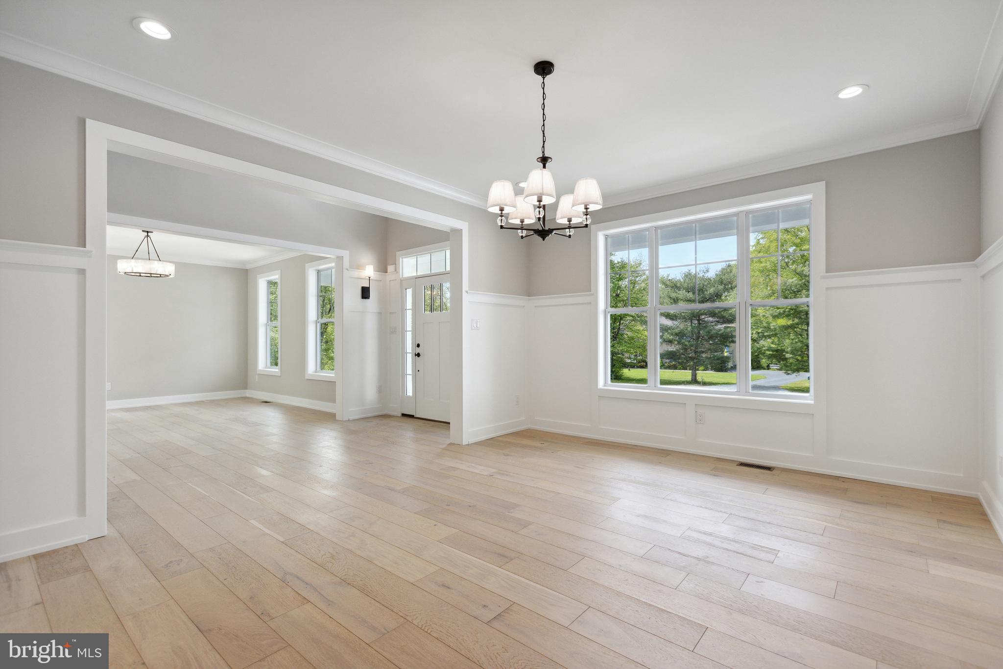 1 Beech Hollow Road Lower Gwynedd, PA 19002 - Photo 7 of 17 a view of livingroom with chandelier and hardwood floor
