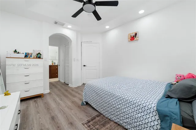 a bedroom with a bed and furniture