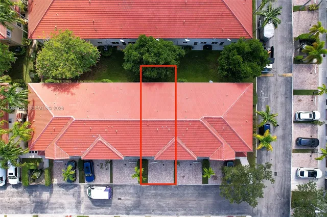 an outdoor space with furniture and umbrella