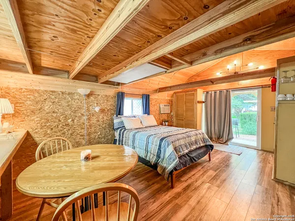 a bedroom with a bed and a table