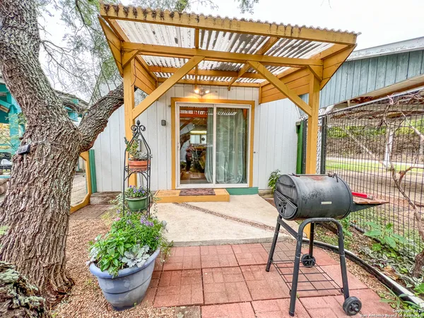 a view of a chairs and table in the patio