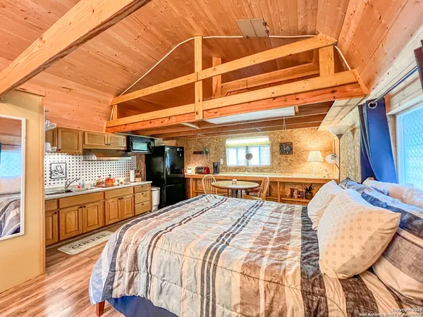 a bed room with a bed and a chair