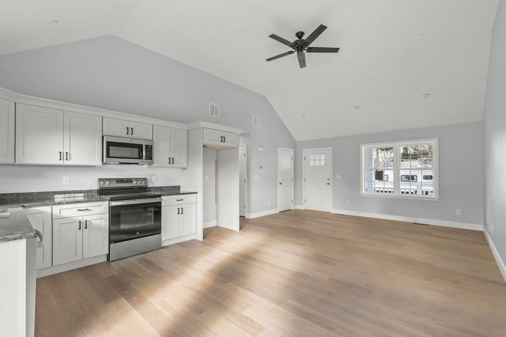 81 Maple Springs Road Wareham, MA 02571 - Photo 4 of 17 a view of a kitchen with a sink cabinets and window