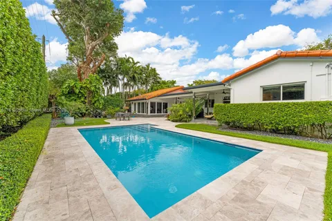 a view of swimming pool with a patio