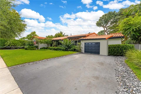 a view of house with outdoor space and garden