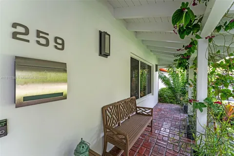 a balcony with table and chairs