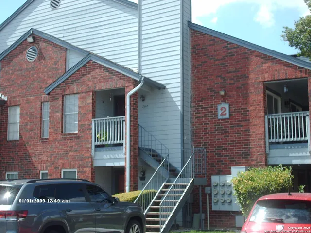a front view of a house with stairs