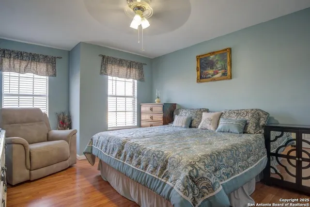 a bedroom with a bed and a couch