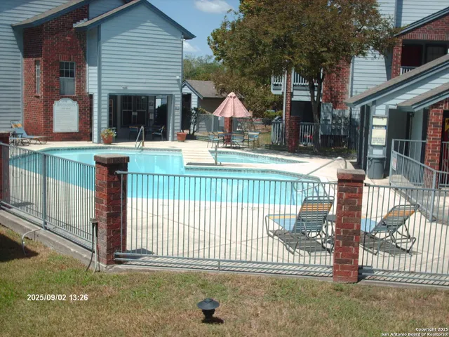 a view of a house with a iron gate