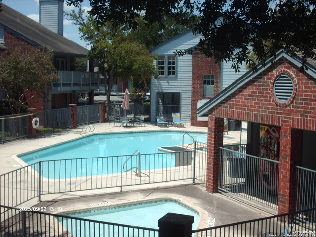 a view of a house with a wooden deck
