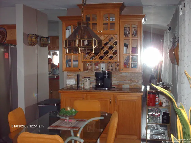 a front view of a house with outdoor seating