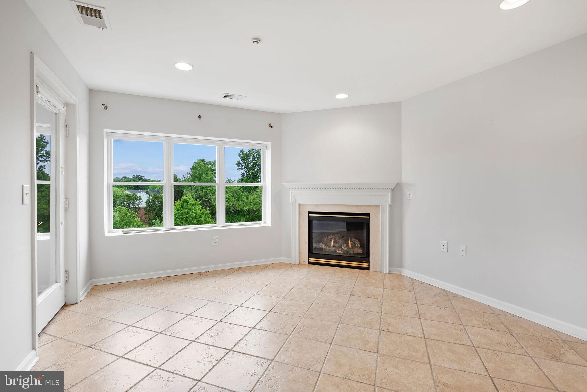 12246 Roundwood Road, Unit 506 Lutherville-Timonium, MD 21093 - Photo 15 of 32 Kitchen w/ Gas Fireplace