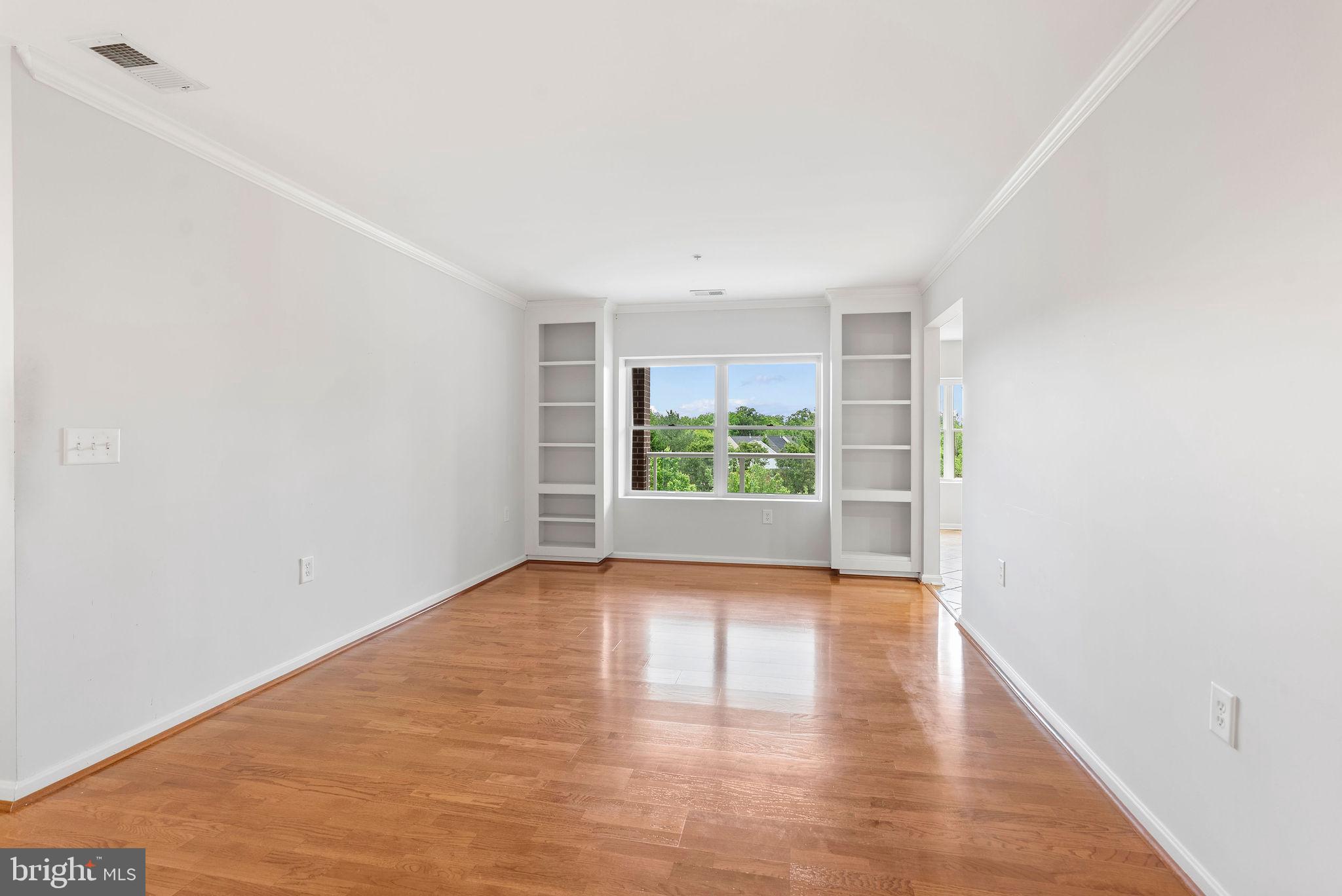12246 Roundwood Road, Unit 506 Lutherville-Timonium, MD 21093 - Photo 9 of 32 Living Room w/ Built Ins