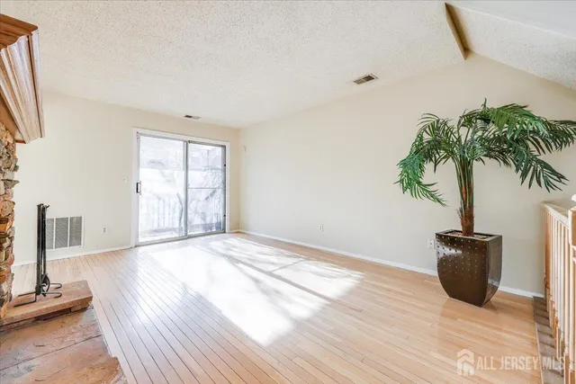 a view of an empty room with a potted plant