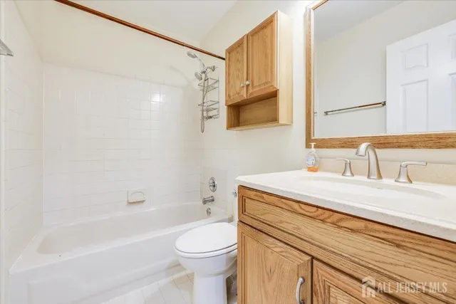 a bathroom with a sink a toilet and a bathtub