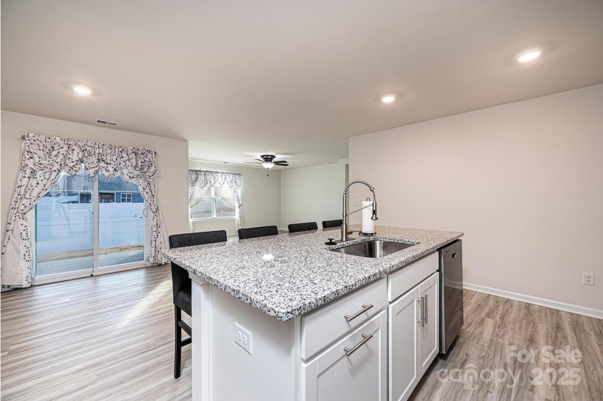 2542 Goose Fair Road Maiden, NC 28650 - Photo 17 of 48 a kitchen with a granite countertop sink and stove