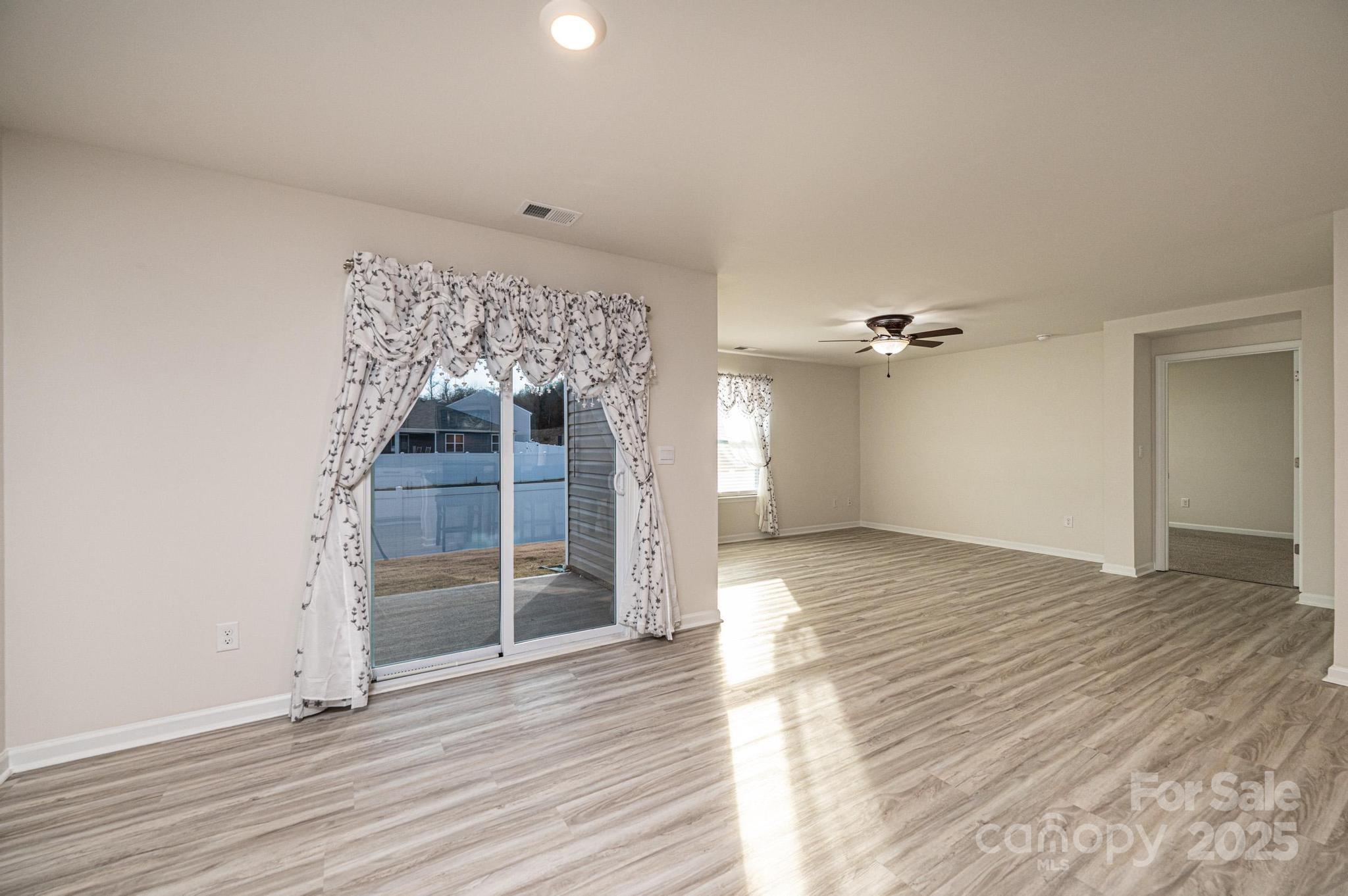 2542 Goose Fair Road Maiden, NC 28650 - Photo 19 of 48 wooden floor in an empty room with a window