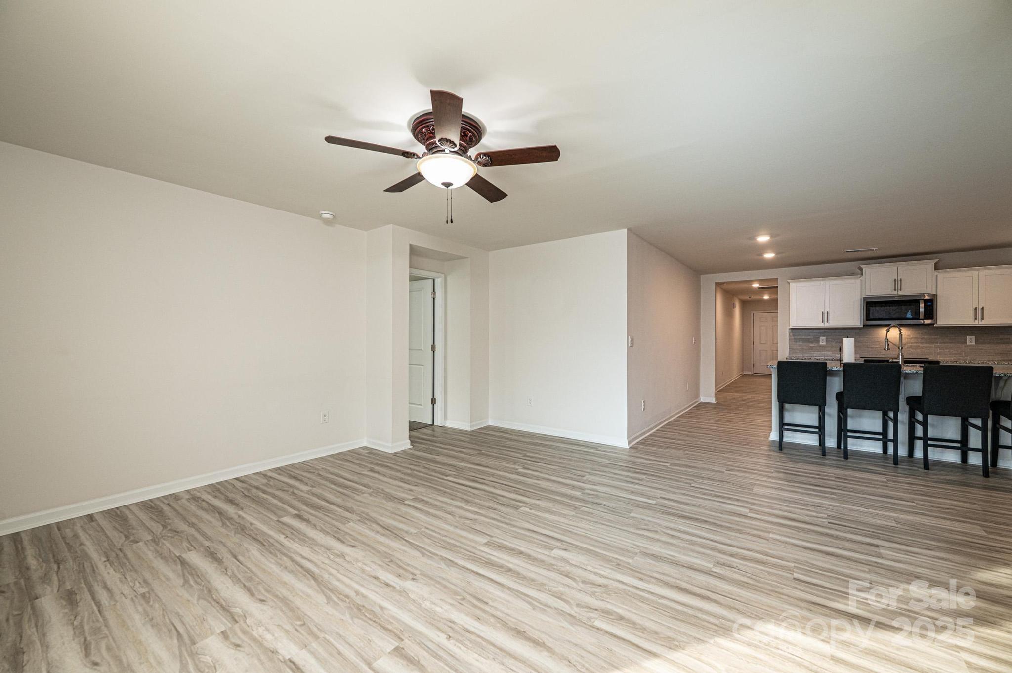 2542 Goose Fair Road Maiden, NC 28650 - Photo 22 of 48 a view of a room with wooden floor and a ceiling fan