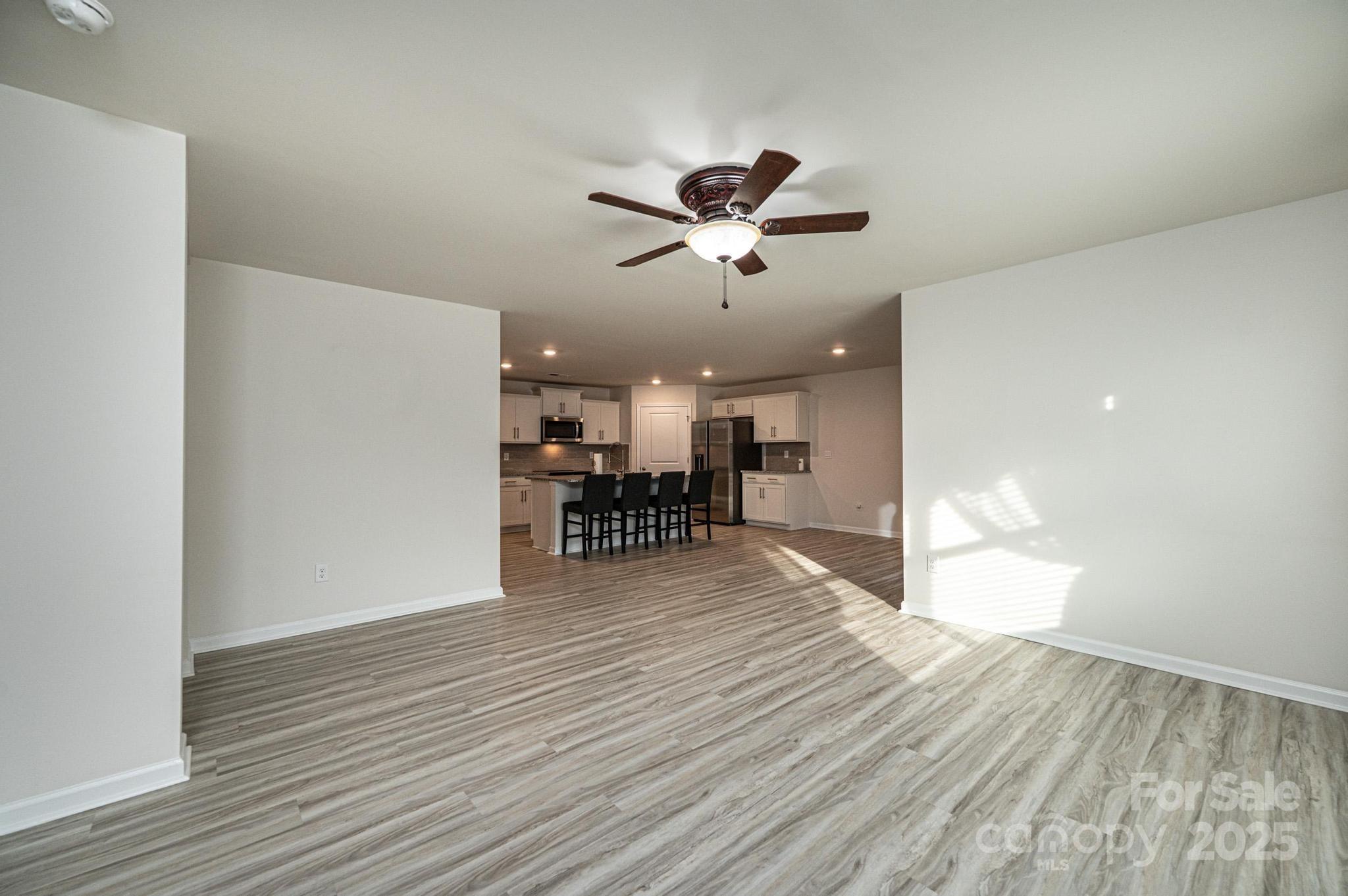2542 Goose Fair Road Maiden, NC 28650 - Photo 23 of 48 a view of a room with wooden floor and a ceiling fan