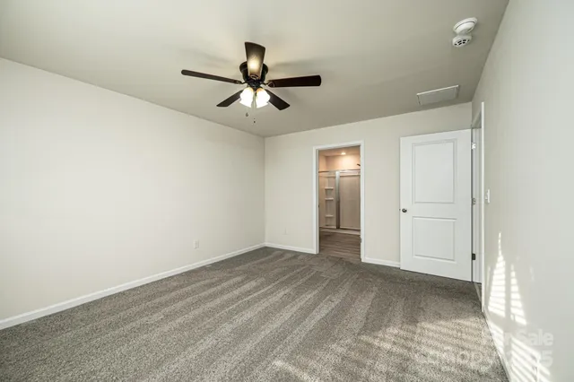 a spacious bathroom with a shower sink double and mirror