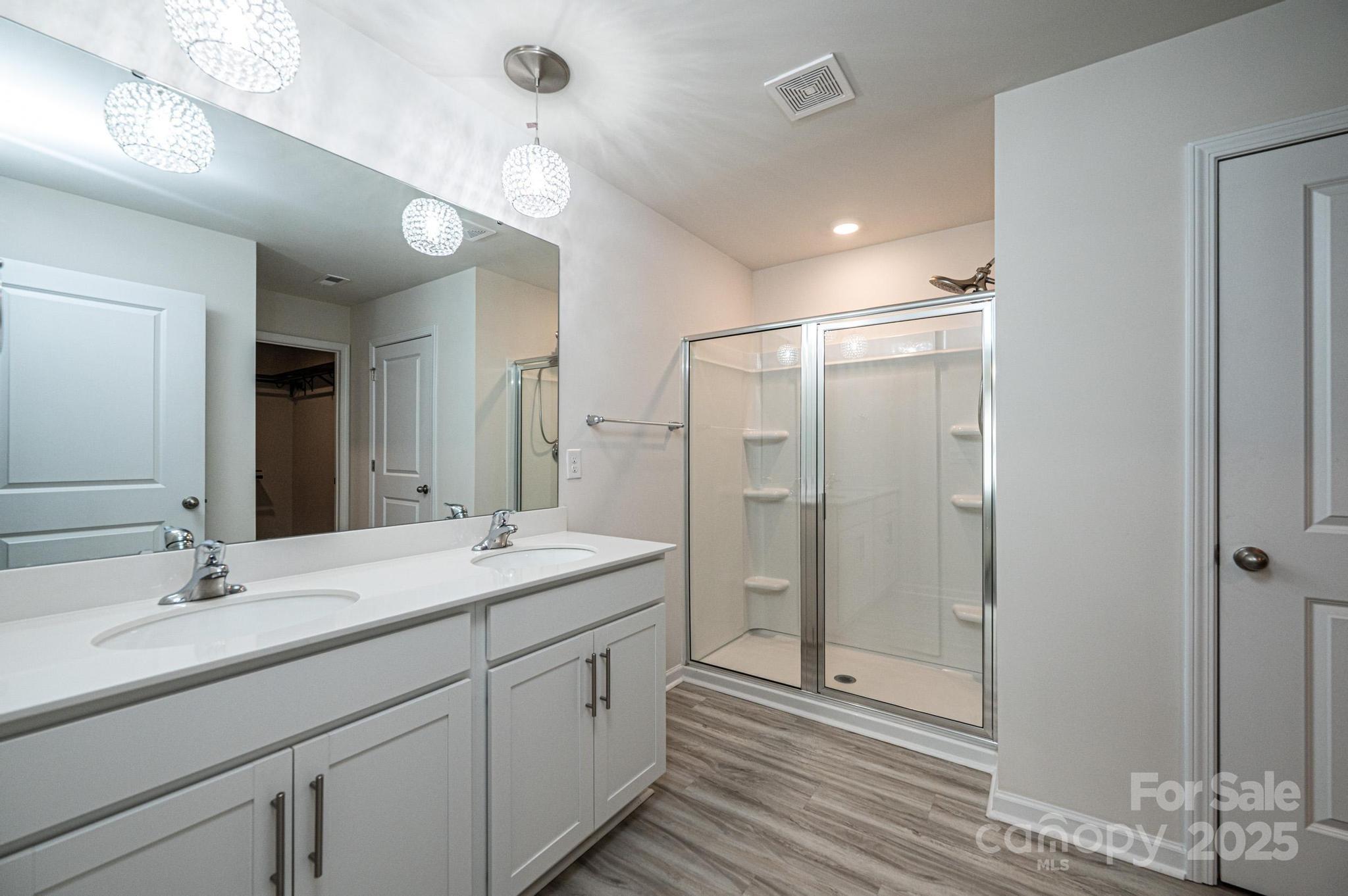 2542 Goose Fair Road Maiden, NC 28650 - Photo 27 of 48 a spacious bathroom with a shower sink double and mirror