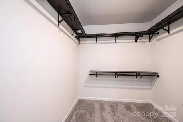 a view of a room with gym equipment and a window